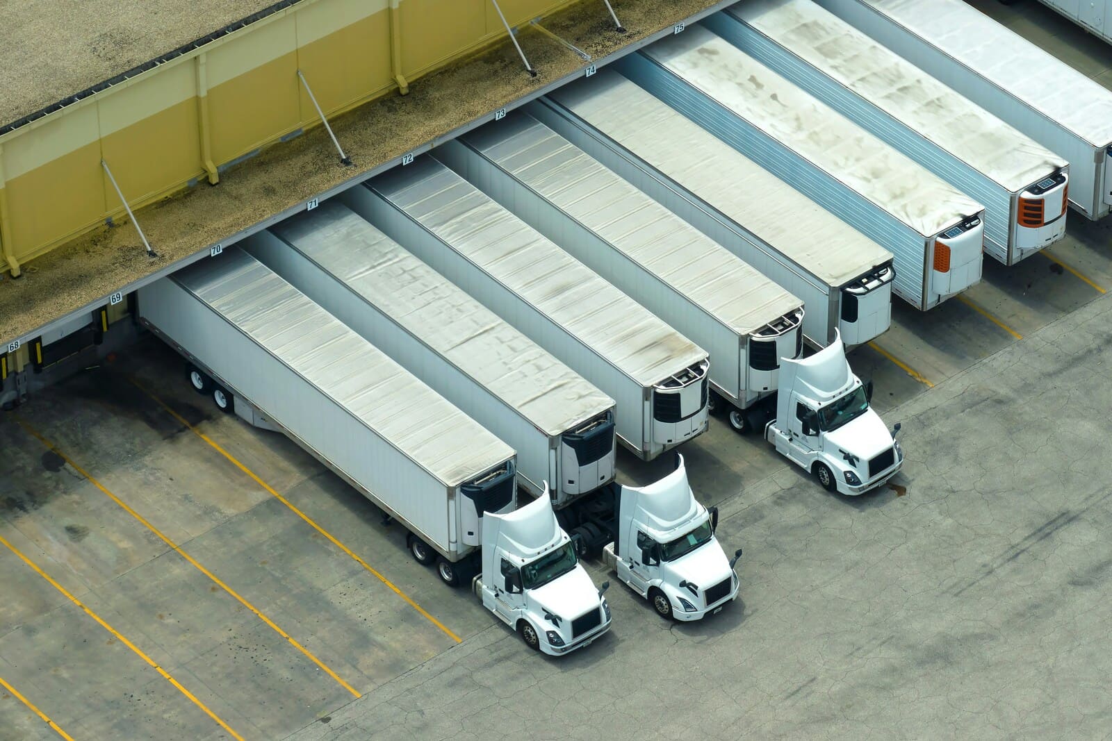 Loading dock with lined up logistics trucks for efficient cargo transport